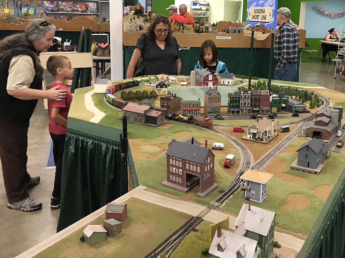 Kids watching trains at the Train Show
