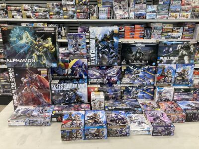 stack of unopened Gundam boxes