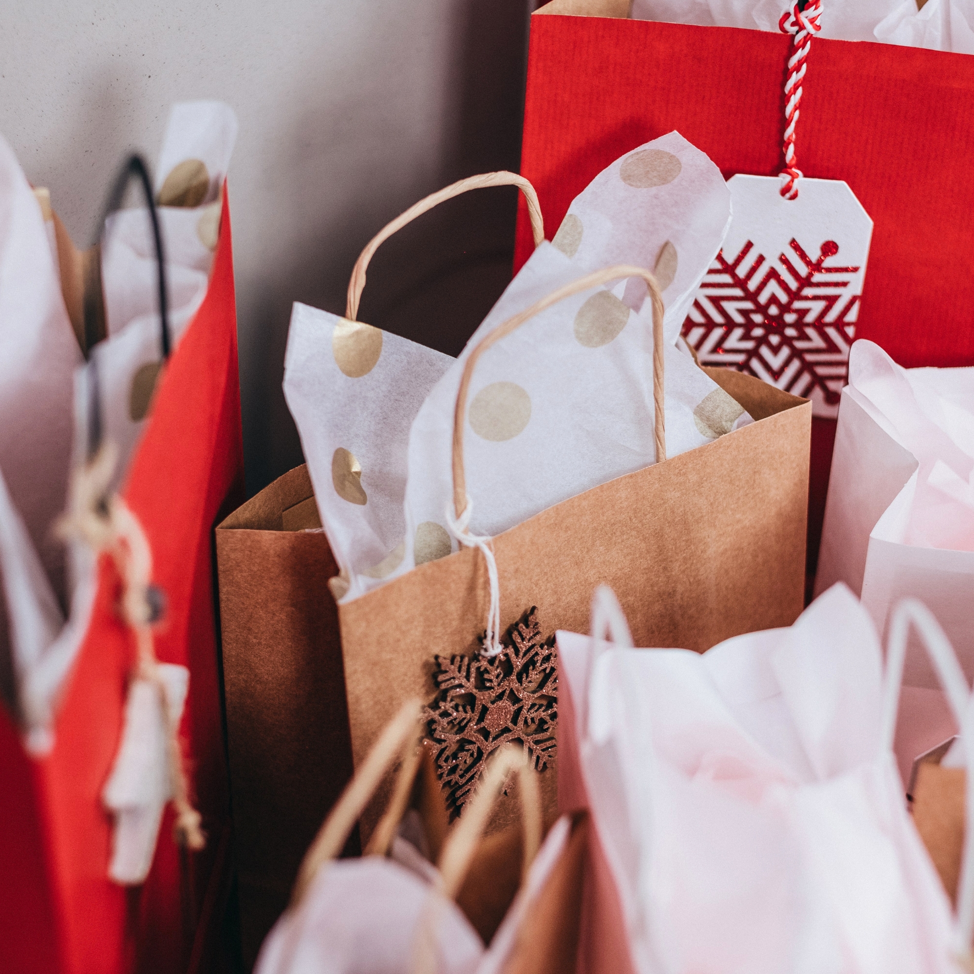 a bunch of holiday gift bags