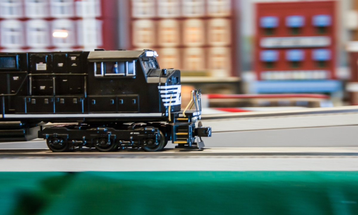 a model train speeding through a model city