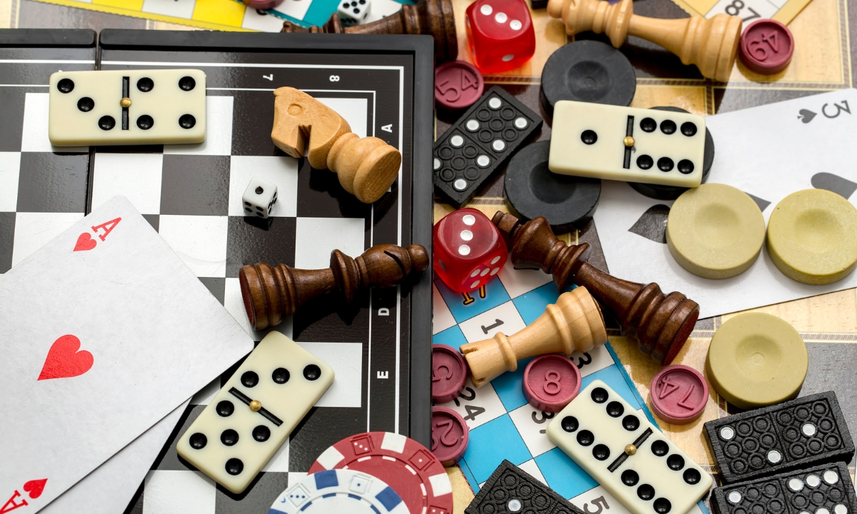a bunch of board games and pieces spilled together